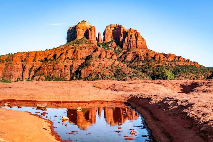 Cathedral Rock and a still creek pool in Sedona